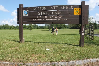 A couple strolls through the Princeton Battlefield State Park. The Institute for Advanced Study is proposing to build a new site beyond these trees.